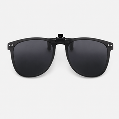 A black universal clip-on sunglass attachment designed to fit over kids’ prescription glasses for easy outdoor sun protection. 