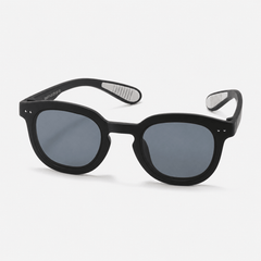 Kids flexible silicone prescription sunglasses with round frames, dark UV lenses, and non-slip ear grips.
