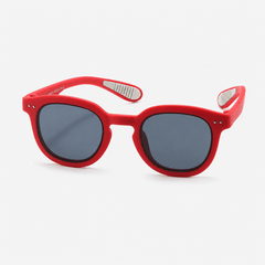 Kids flexible silicone prescription sunglasses with round frames, dark UV lenses, and non-slip ear grips.
