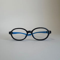 PureFlex oval kids flexible glasses in black and blue silicone material, showcasing the lightweight frame and flexible temple arms for children.