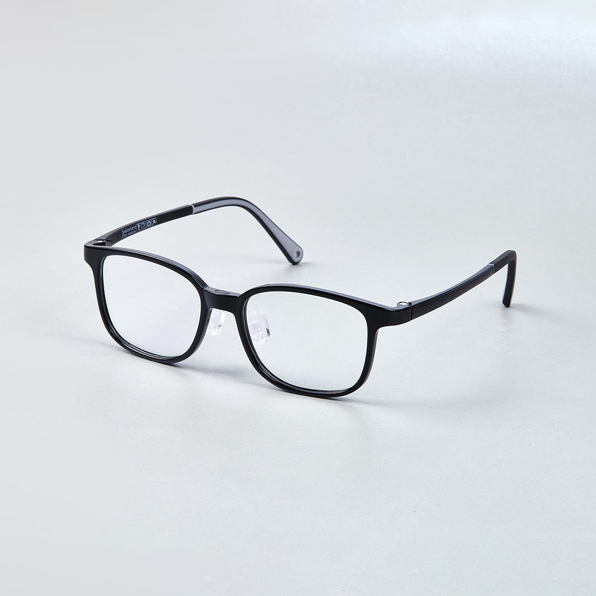 MiniMuse crystal grey square kids prescription glasses with adjustable temple tips. Side view.
